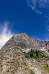 Clouds over mountain rock formations scenic landscape travel