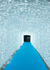 A long perspective tunnel fully covered with sparkling Christmas lights. Vertical photo.
