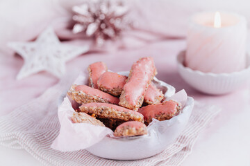 Christmas cookies with pink sugar frosting on pink background