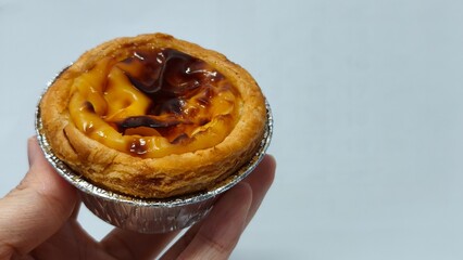 Closed up of Portuguese egg custard tart pastry. Pastel de nata with copy space