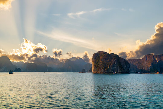 lHa ong Bay, with limestone hills and sunset sky. Landscape of Ha Long bay, a UNESCO world heritage site and a popular tourist destination in Vietnam