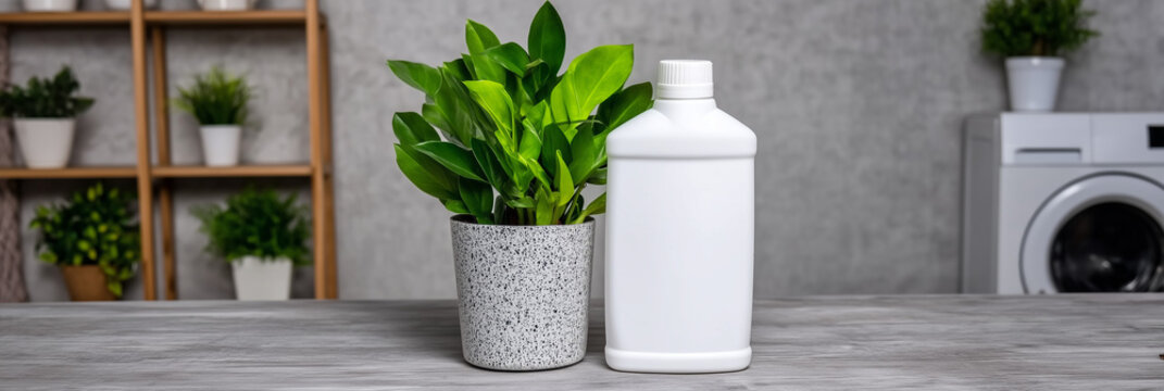 White plastic bottle mockup for laundry detergent with green houseplant. Eco-friendly cleaning product in a home interior. Natural household supplies branding concept for banner