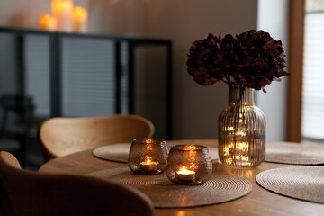 Led lights and interior decor on wooden table in scandinavian room. Hygge life style.