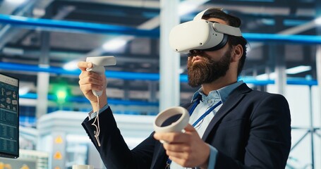 Photovoltaics factory engineer planning work on facility floor in CAD software using VR headset....