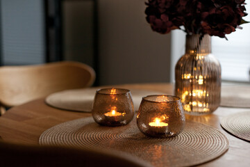 Led lights and interior decor on wooden table in scandinavian room. Hygge life style.