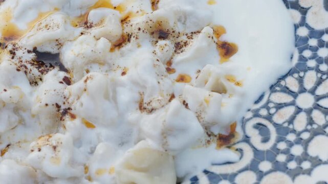 Close-Up of Traditional Turkish Manti on a Blue Plate	
