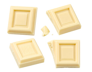 Four delicious white chocolate squares and a tiny crumb, on black
