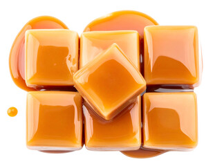 Six glossy caramel squares with melting sauce on a black background