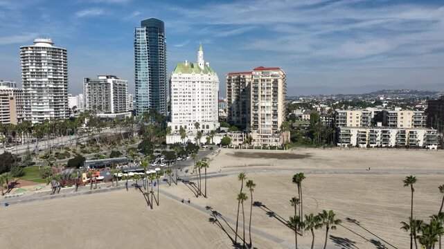 Long Beach, California, USA - Aerial View of Downtown Long Beach, CA on the Beach Path With Runners on Alamitos Beach With Luxury Apartments and Condos on Ocean Blvd 