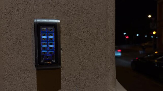 Busy street with colorful lights, Dynamic cityscape featuring illuminated intercom and moving traffic