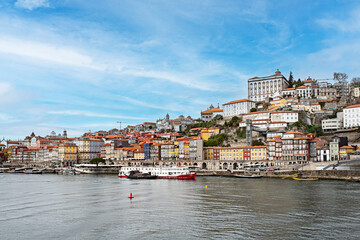 Colorful buildings at Ribeira Quay, iconic postcard location on the banks of the Douro River, famous for its medieval alleys and lively nightlife, UNESCO World Heritage Site. Porto, 2023