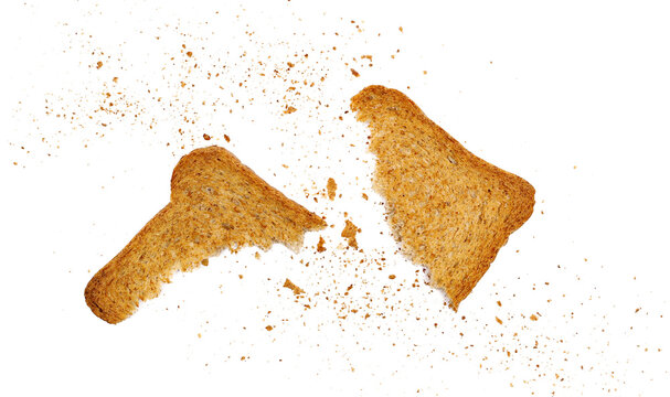 Broken rusks with wholewheat flour, pieces whole wheat dry bread with crumbs isolated on white background, top view