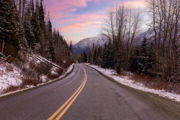 Snowy Mountain Road Through Calm Forest in British Columbia, Canada — Serene Winter Landscape