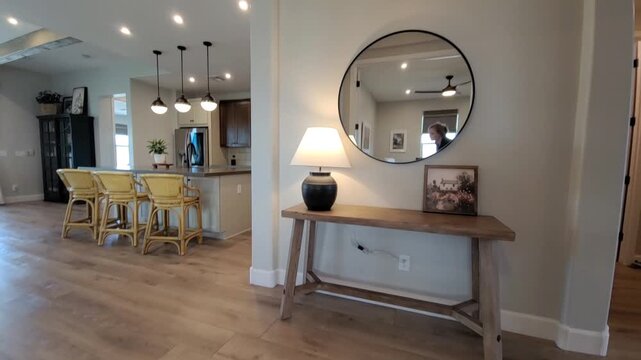 Entryway Console Mirror Pendant Lights Kitchen Glimpse Warm Wood Flooring Welcoming Foyer Vignette Decor