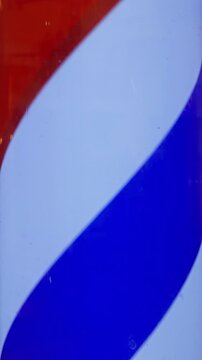 Textured metallic surface featuring curved red stripe on blue panel with vintage aesthetic and scratches