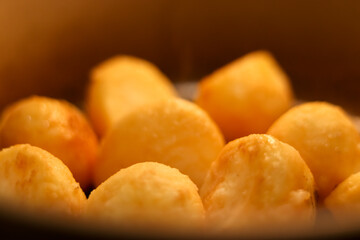 Golden fried potatoes offering a delicious comforting snack, fresh warm baked cooking food close up