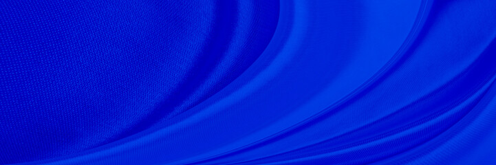 Black blue satin dark fabric texture luxurious shiny that is abstract silk cloth background with patterns soft waves blur beautiful.