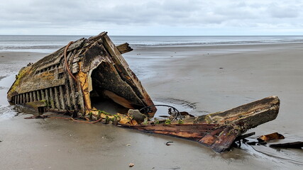 Small fishing boat shipwreck on the North beach-Rose Spit near Massett on Haida Gwaii, BC, Canada.