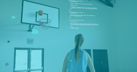 Standing woman wearing light-blue jersey watching basketball over hoop in gym, digital overlay