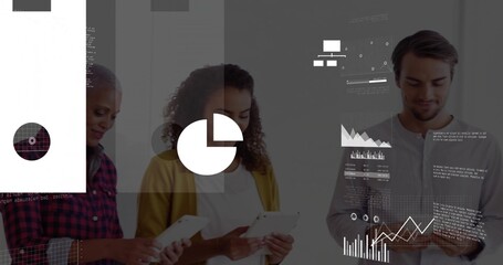 Reviewing group in casual-professional clothes at office, tapping tablets and viewing pie charts
