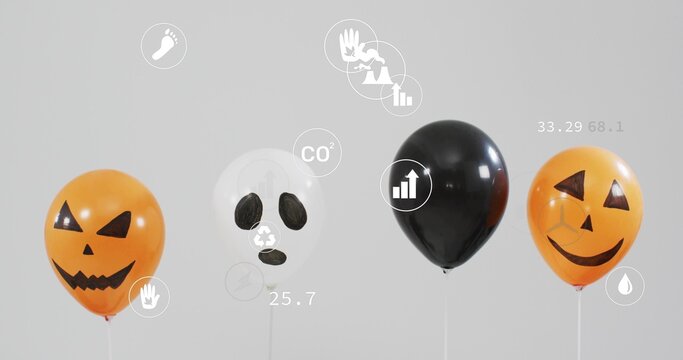 Displaying 4 balloons: 2 jack-o'-lanterns, 1 skull, 1 black on white sticks in studio, infographics