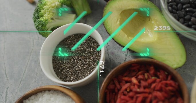 Displaying white chia bowl sitting on gray stone tabletop with avocado, broccoli and green overlay