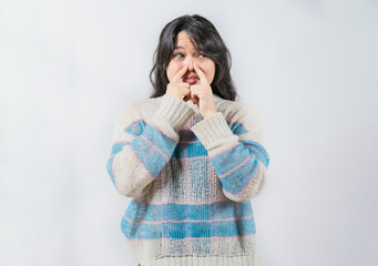 Asian woman with face of unpleasant odors, covering nose. Person covering nose because bad smells....