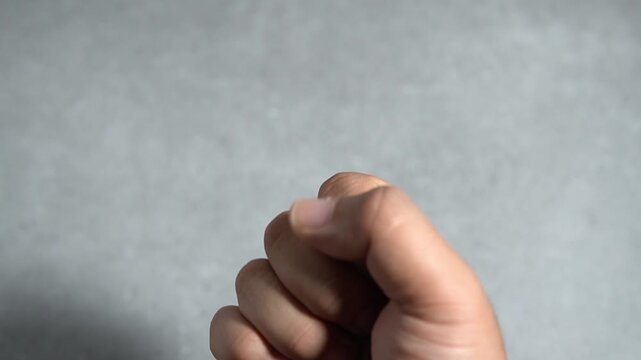 Hand showing finger counting gesture. Close-up video of counting numbers one to five for education, tutorial, and communication themes.