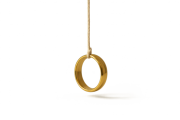 Plain gold ring suspended by a rope, isolated on transparent background with shadow.