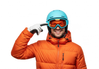 Smiling male skier in orange jacket and blue helmet pointing at goggles, winter sport enthusiast