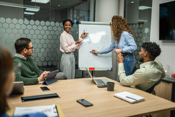Diverse business team collaborating during office presentation meeting