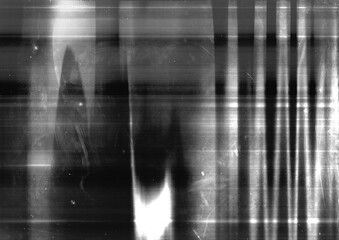 Abstract grunge black and white screen background. Distressed light streaks graphic element. Suitable for overlay design, poster element, or film grain effect.