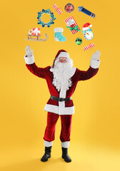 Santa Claus levitating Christmas decor and gift box on orange background. Festive magic