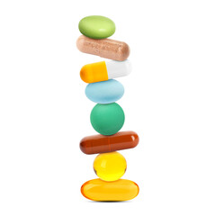 Different pills stacked on each other against white background