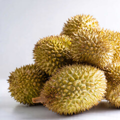 A close-up view of stacked durians showing detailed spikes and natural surface texture. Suitable for tropical produce themes, agricultural content, and Asian market imagery.