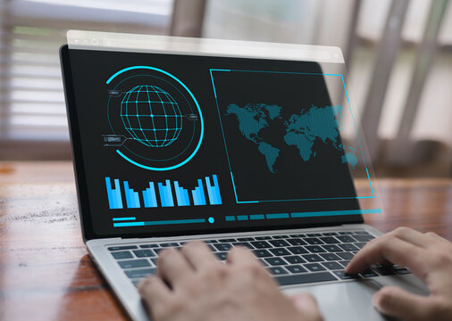 Digital global analytics dashboard with world map, data charts, and futuristic interface displayed on a laptop, representing worldwide data monitoring, business intelligence, analysis. - Powered by Adobe
