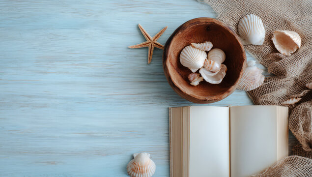 Serene arrangement of seashells wooden bowl beside open book light blue wooden surface evokes