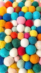 Colorful felted balls piled closely