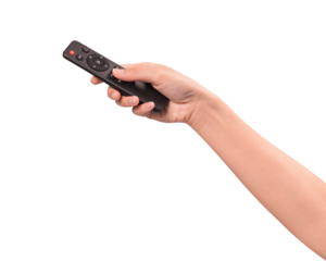 Hand holding remote control isolated on isolated on transparent PNG.	
