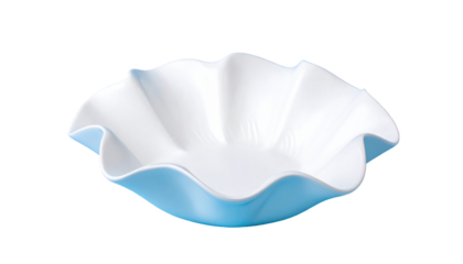 A wavy-edged, blue exterior, white interior ceramic bowl, centered on a black background, lit from above