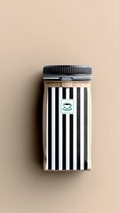 A coffee bag with a black and white striped design and a coffee cup logo is displayed against a neutral background.