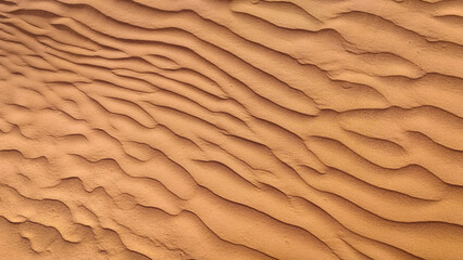 Close-up Abstract Pattern of Golden Desert Sand Ripple Marks on Dune Surface in Moroccan Sahara