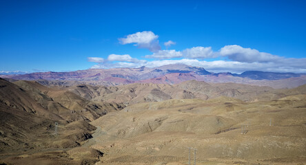 High Angle View of Rolling Arid Mountains and Terraced Hills Under a Bright Blue Sky in Morocco