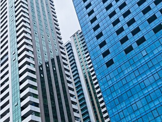 Dynamic architectural view of modern glass skyscrapers and residential towers in Batumi, Georgia
