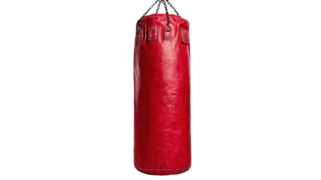 Red punching bag hanging, symbolizing boxing, fitness, combat sports training, workout, and exercise on a transparent background