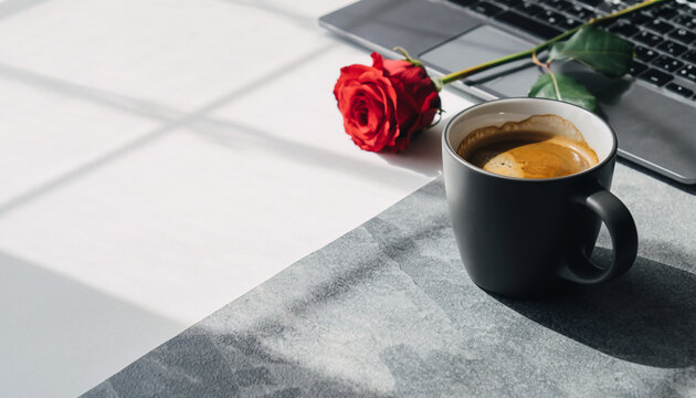 Coffee cup red rose laptop sunlight workspace desk romantic morning clean minimal style create peaceful and inspiring office environment for valentine marketing or daily work