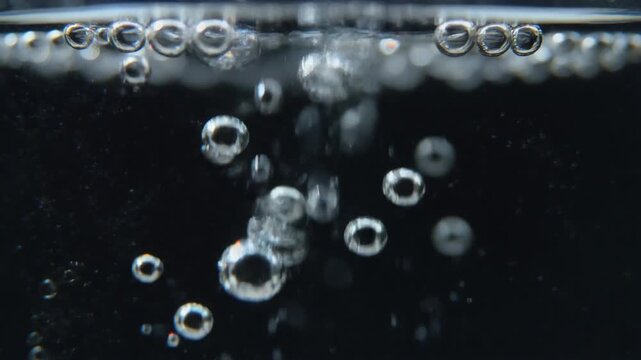 Bubbles rising through liquid creating a visually captivating display