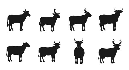 Obraz premium Collection of Black Silhouettes of Cows in Various Poses.