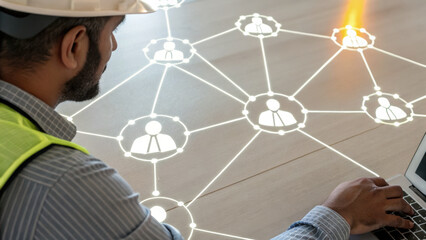 Social Security Contribution Concept. worker interacts with laptop while glowing markers connect to worker icons, showcasing high tech network