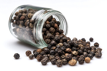 Freshly ground black peppercorns spilling from a clear glass jar, a culinary essential for adding bold flavor to any dish, ideal for gourmet cooking and spice blends, enhancing savory meals